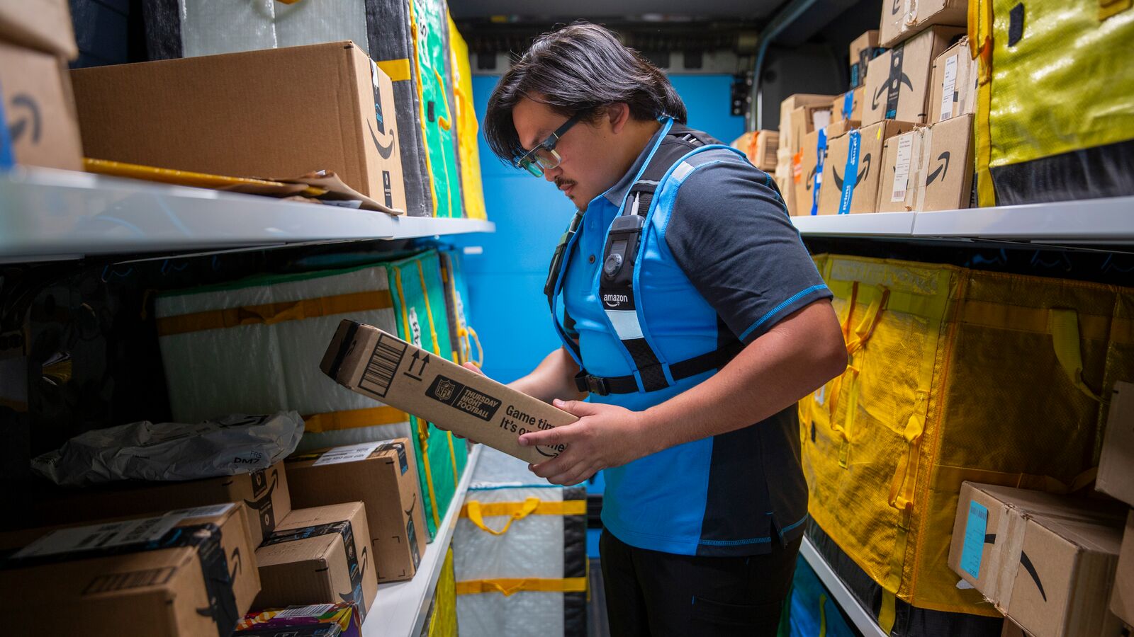 Delivery associate wearing Smart Delivery Glasses inside a delivery vehicle