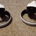 PlayStation VR2 Sense controllers on a dark surface
