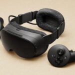 Valve Steam Frame VR headset and controllers on a studio surface
