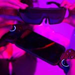 ELO Sentinel XR Gaming Glasses product photo on purple background