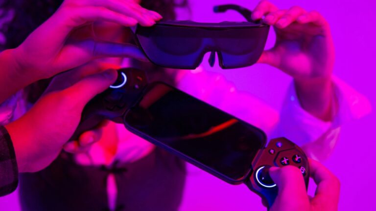 ELO Sentinel XR Gaming Glasses product photo on purple background