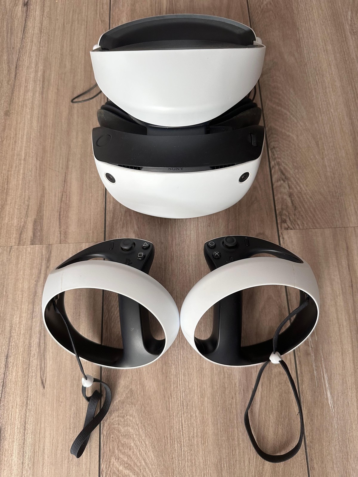 PlayStation VR2 headset on a dark surface