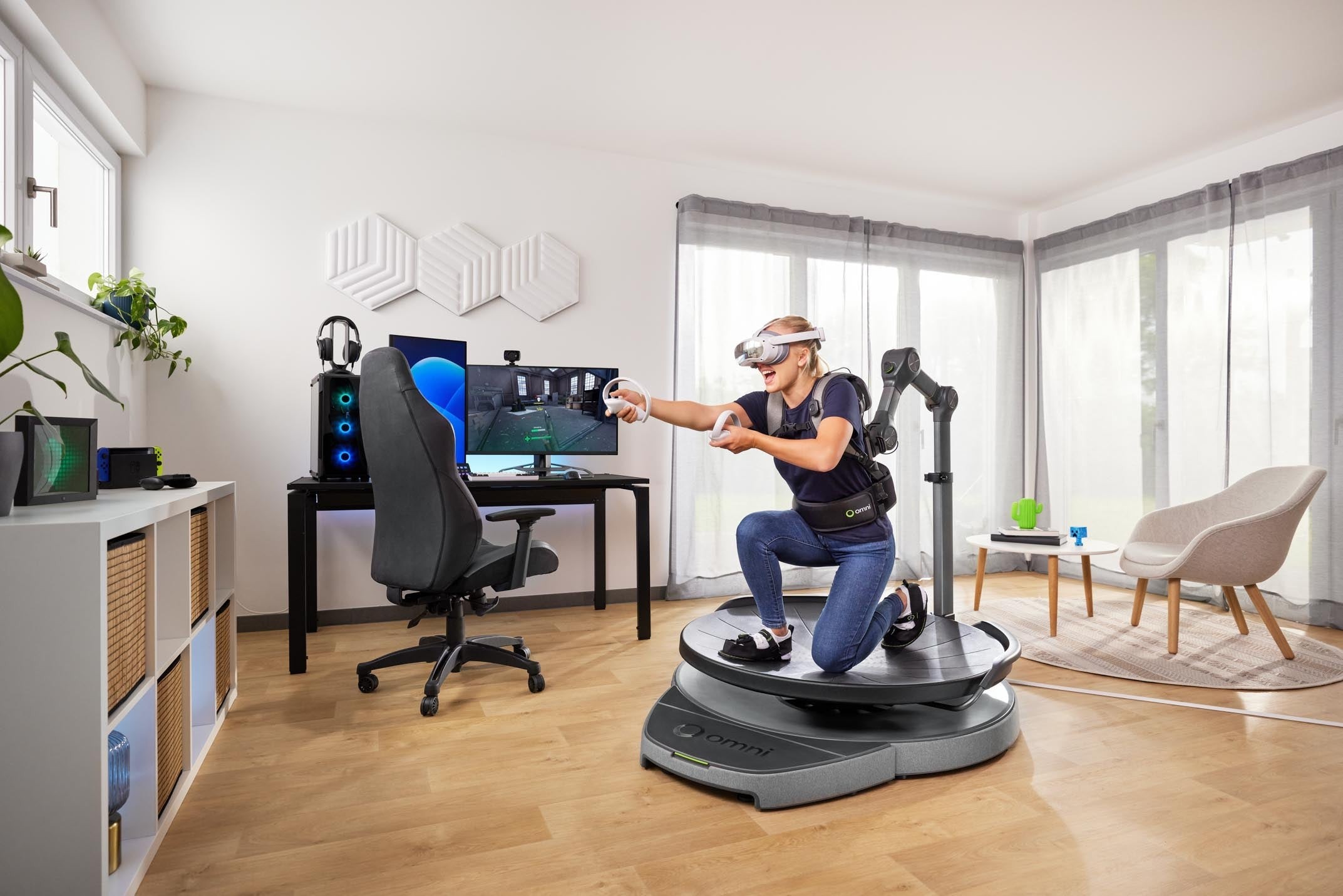Virtuix Omni One full-body VR system with kneeling stance and tracked firearm prop