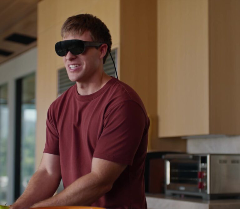 Person wearing Meta VR Glasses in a kitchen during a Hologram calling demo