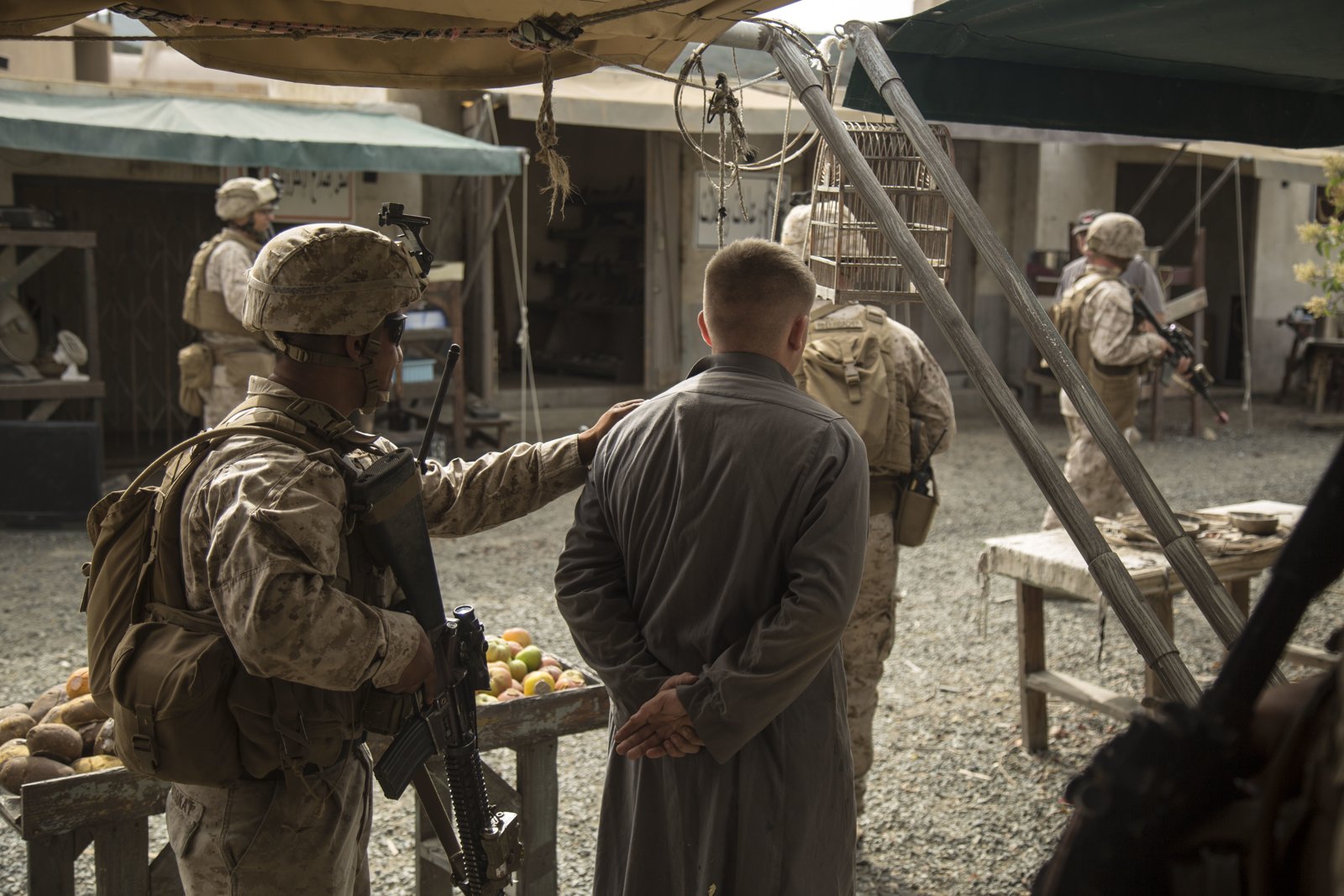 U.S. Marines training inside an Infantry Immersion Trainer facility (public domain, U.S. Marine Corps)