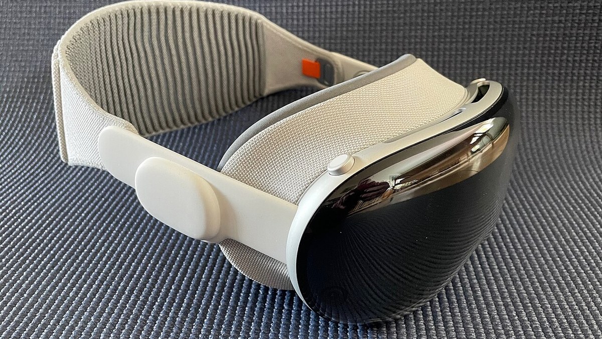 Apple Vision Pro headset on a table, side view