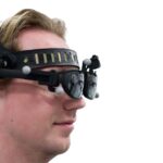 Surgeon wearing OnPoint AR headset during spine navigation