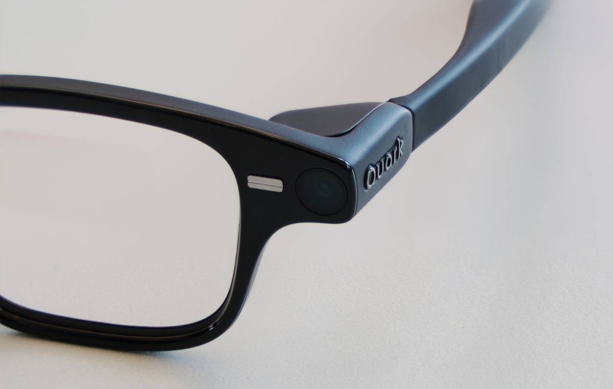 Close-up of Quark smart glasses camera and Quark branding on the temple