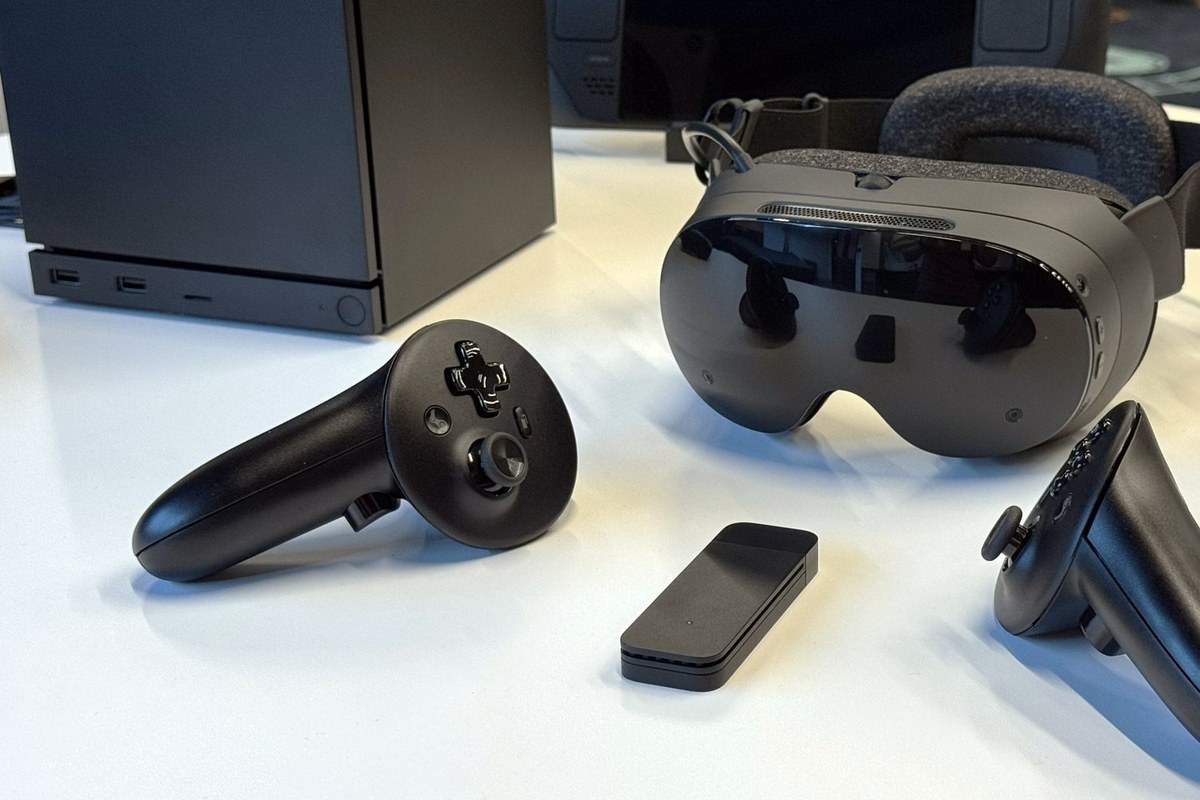 Steam Frame headset shown in a hands-on desk setting