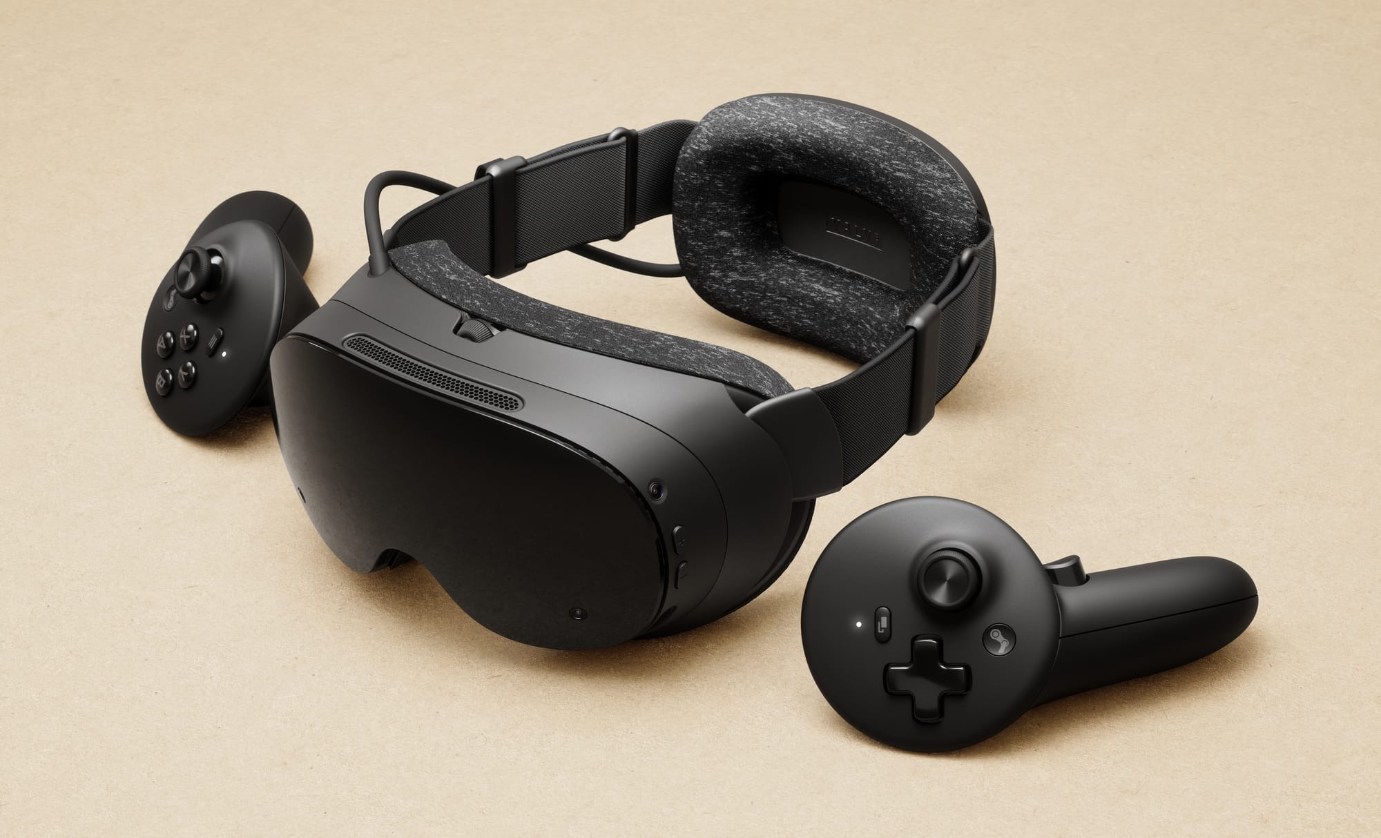 Steam Frame headset and controllers on a light surface