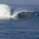 Surfer riding a wave at Teahupoʻo, Tahiti. Wikimedia Commons.