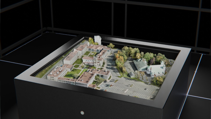 Avalon Holographics NOVAC glasses-free holographic table display showing a 3D city model