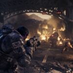 Marcus Fenix and squadmates fire on Locust troops beneath a burning bridge in a Gears of War: E-Day campaign screenshot