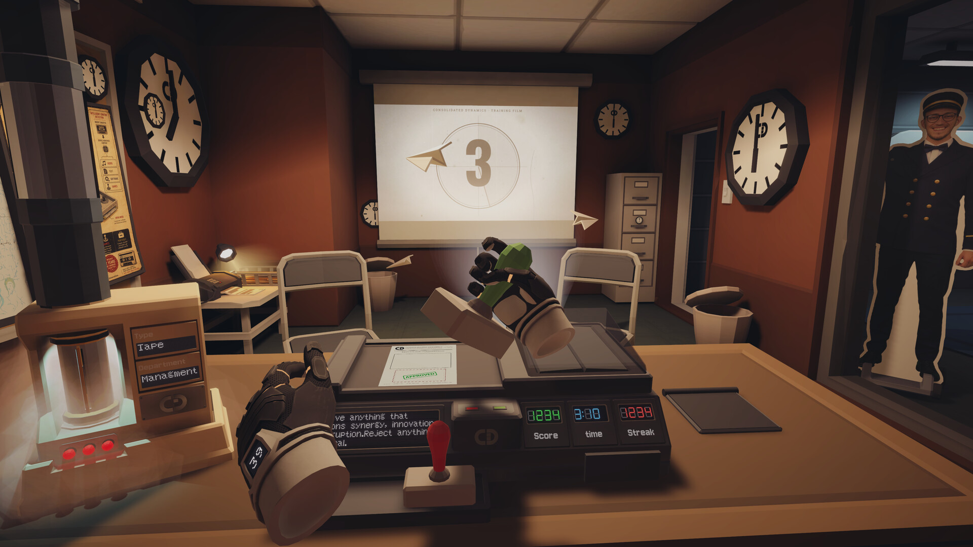 Good Morning [Employee Name] VR screenshot: a desk station with a training-film countdown on a projector screen and a cardboard-cutout coworker