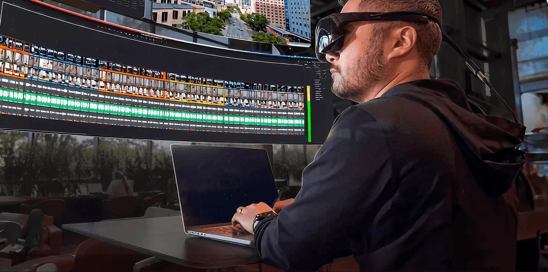Immersed Visor worn with virtual workspace screens — official Immersed marketing imagery