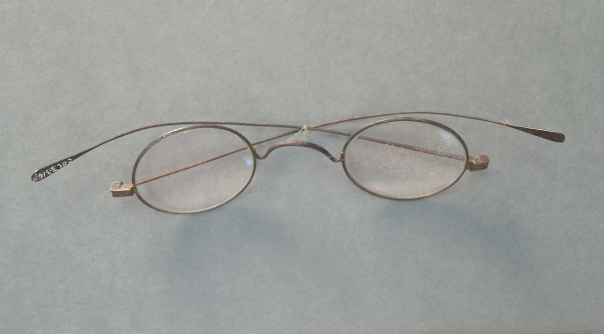 Historic eyeglasses and case in museum collection