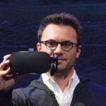 Brendan Iribe, then Oculus CEO, holding the consumer Oculus Rift in 2015 (eVRydayVR, CC0, via Wikimedia Commons)