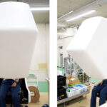 Kyushu University mountless aerial HMD chair with micromirror optics projecting a stereoscopic VR scene