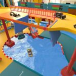 Loony Laps press screenshot showing die-cast toy cars racing on a tabletop track