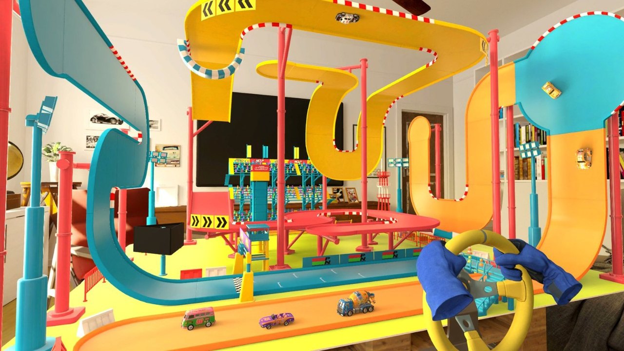 Loony Laps press screenshot showing gloved virtual hands on a steering wheel beside a multi-level toy car track