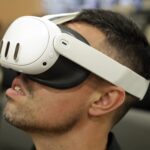 A man wearing a Meta Quest 3 mixed reality headset