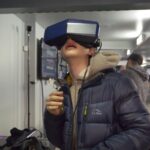A visitor tries a Pimax 8KX headset at a Pimax demo session (Calvinyau, CC BY-SA 4.0, Wikimedia Commons)
