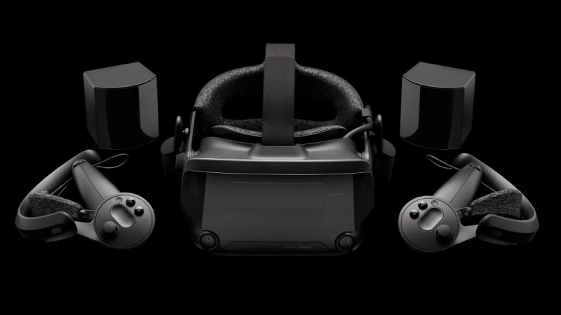 Valve Index headset, two Index controllers and two base stations on a black background