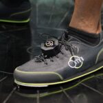Virtuix Omni overshoe with clip-on foot tracker on the low-friction platform, CES 2016