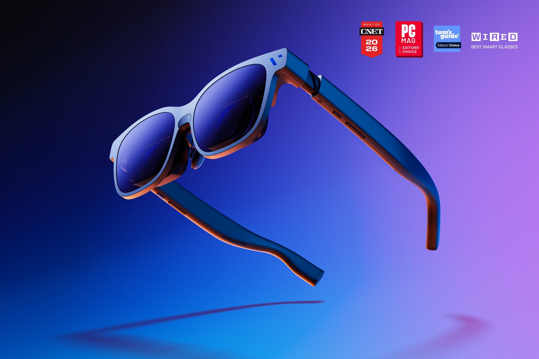 Viture Beast XR glasses on blue background with CNET PCMag Tom's Guide WIRED award badges