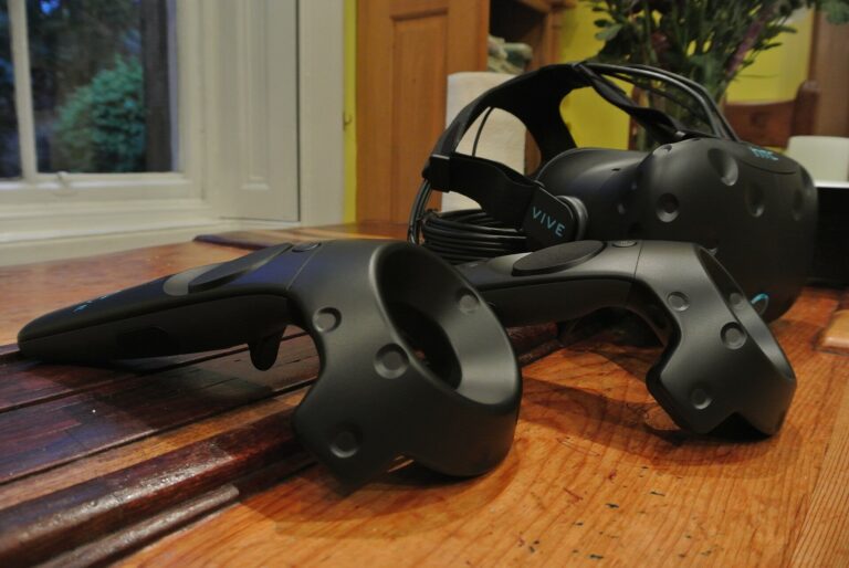 HTC VIVE headset and two VIVE wand controllers, which are tracked by SteamVR Lighthouse base stations