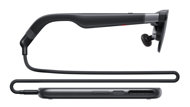 XREAL AURA glasses connected by cable to the compute puck, side view